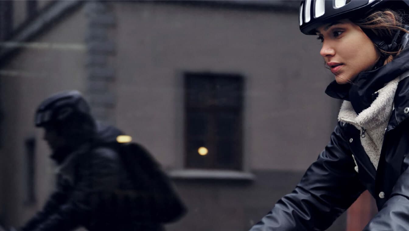 Woman on bike wearing a helmet